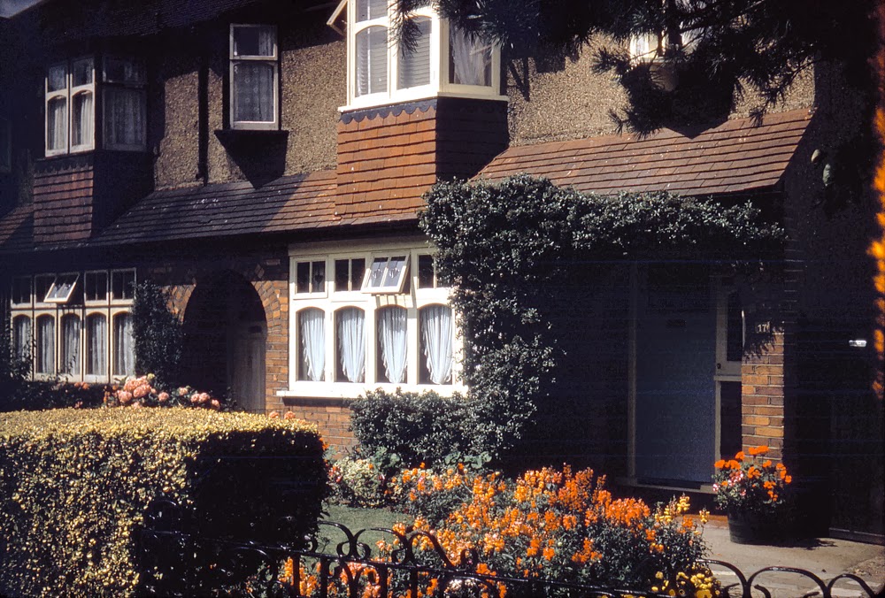 The first colour shot I ever took: My childhood home in Station Avenue, a quintessential English semi, with floral garden, in a typical London commuter suburb — Ewell in Surrey.